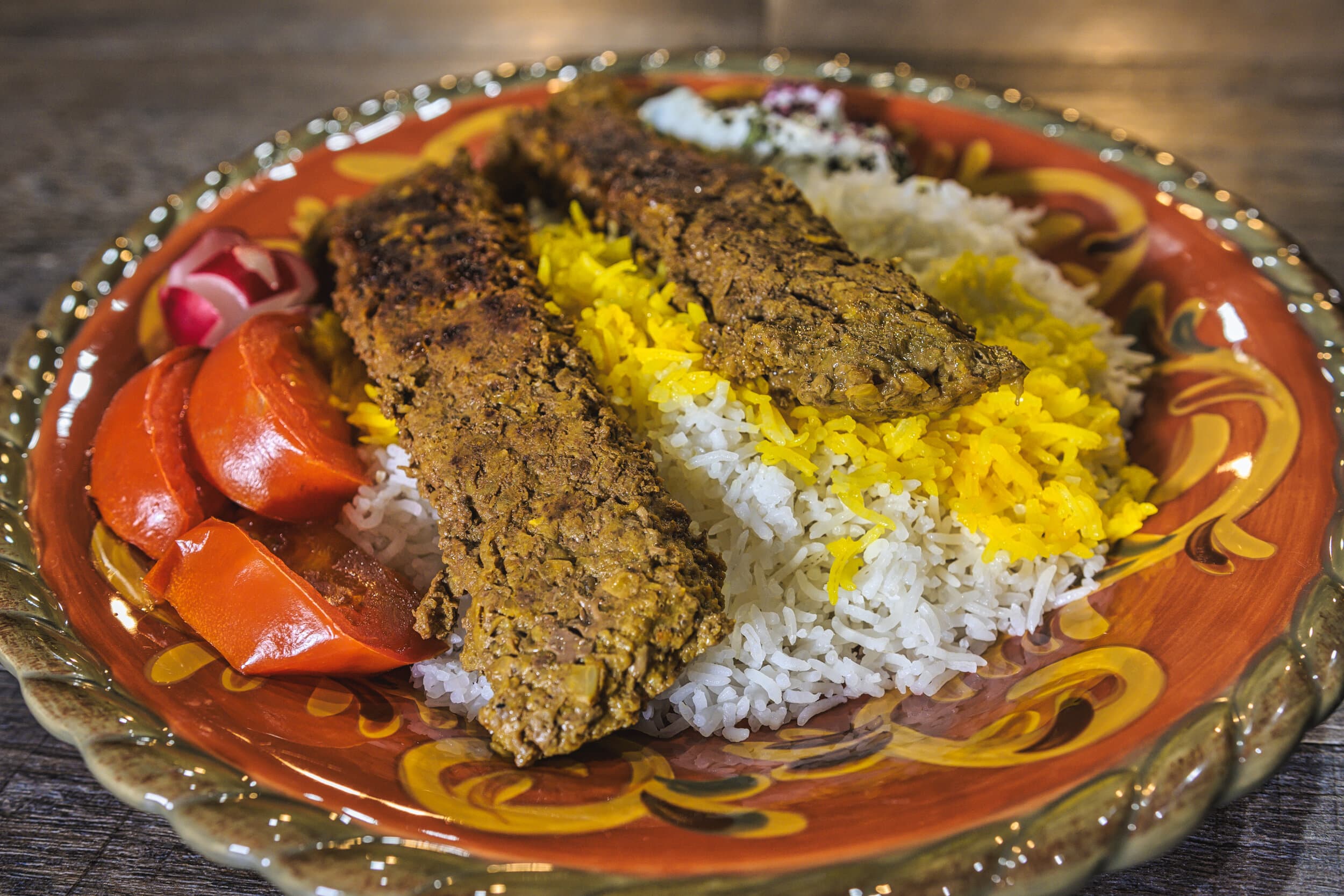 Persian Pan-Fried Kabab Tabei Platter with Bean Salad and Golden Rice